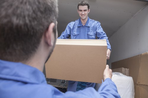 Removal van and movers preparing for a house move in Hampton