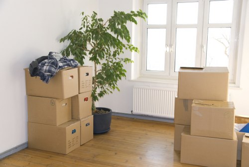 Packing fragile items carefully for house removals in Hampton