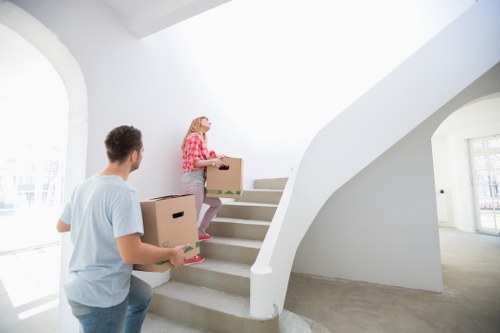Professional movers carrying furniture for a student move in Hampton