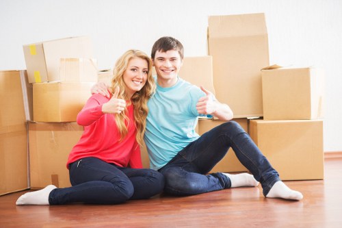 Business team planning office removals in Hampton with floor layout